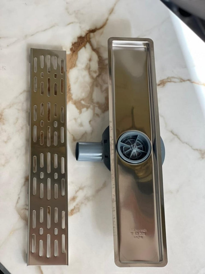 shower-drain-with-a-hollow-face-and-an-external-steel-letter--50-cm