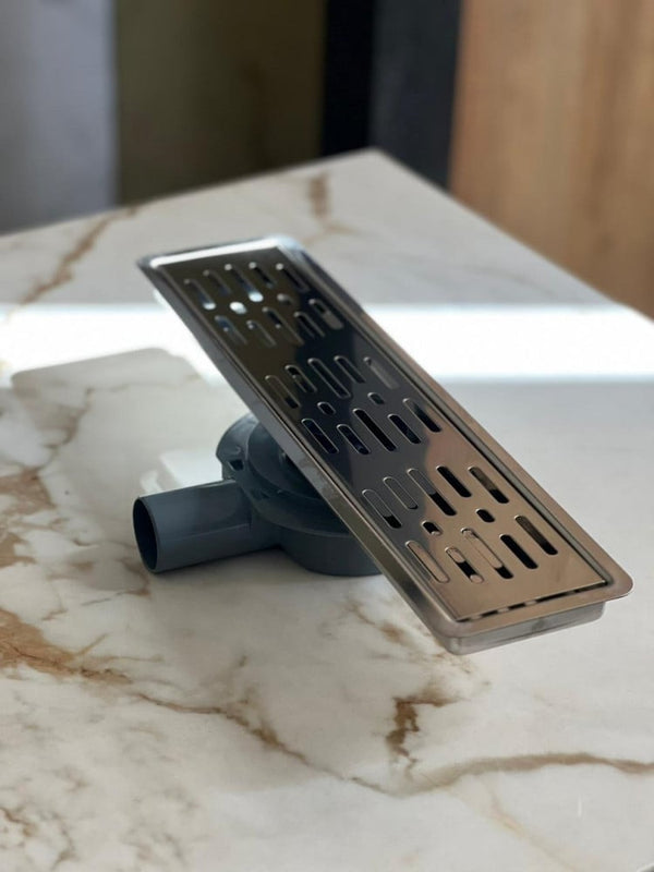 shower-drain-with-a-perforated-face-and-an-external-steel-letter--40-cm