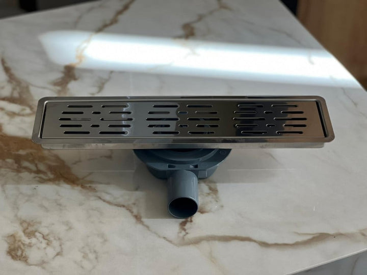 shower-drain-with-a-perforated-face-and-an-external-steel-letter--40-cm