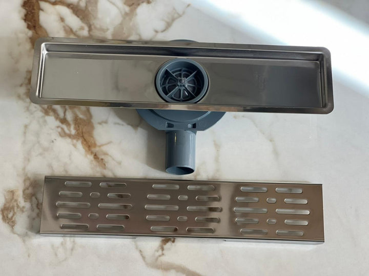 shower-drain-with-a-perforated-face-and-an-external-steel-letter--40-cm