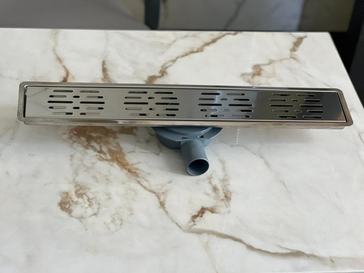 shower-drain-with-a-perforated-face-and-an-external-steel-letter--60-cm