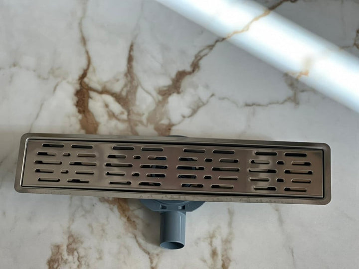 shower-drain-with-a-hollow-face-and-an-external-steel-letter--50-cm