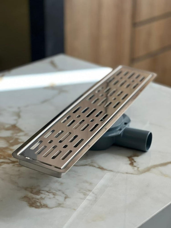 shower-drain-with-a-hollow-face-and-an-external-steel-letter--50-cm